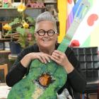 Dunedin community artist Janet de Wagt with one of the guitars Lets go to the hop featuring in...