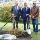 Pictured in front of a young totara, planted to commemorate the coronation of King Charles III at...