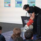 Otago Museum science engagement co-ordinator Pasifika Emily Eastgate conducts experiments with...