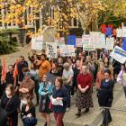 Hundreds of staff and supporters protested earlier this month following the university’s...