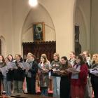 The women of the Southern Youth Choir rehearse a piece, with co-conductor Kaitlyn Freeman, in...