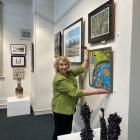Otago Art Society council member and Cleveland National Art Awards organiser Anne Baldock adjusts...