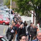 University of Otago staff leave a meeting yesterday where they were informed staff and course...