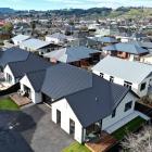 These nearly completed houses in Argyle St, Mosgiel, are some of of 20 new homes being bought or...
