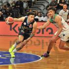 Otago Nuggets import JaQuori McLaughlin looks to move the ball through the court during the...