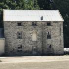 The 1881 Luggate flour mill will be a centrepiece of Murray Frost’s Luggate subdivision. PHOTO:...