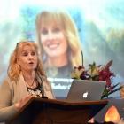 Justine Mouat speaks in memory of her late sister, Logan Park High School co-principal Kristan...