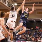 Nuggets guard Michael Harris goes up against Hawks defender Ethan Rusbatch during their National...