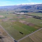 The site of the proposed Tarras airport looking towards Lake Dunstan bounded by State Highway 8 ...