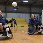 WheelLanders squad members (from left) Morrie Mcleod, Latisha Acott and Matt Russell run a drill...