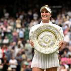 Marketa Vondrousova celebrates with the Venus Rosewater Dish after winning the Wimbledon final...