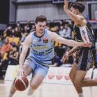 Michael Harris drives towards the hoop during a National Basketball League match against the...