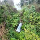 A car careered down a steep bank after failing to take a corner on Wakari Rd and Polwarth Rd...