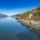 The boatshed, located next to 11 others on Onawe Flat Rd, is well-lined and has basic bench and...
