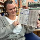 Nikki Wood, of Alexandra, puzzles over the missing listings in the Southern Lakes 2023-24 phone...