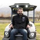 Forest Lodge Orchard owner Mike Casey sits on a new Californian MK-V Monarch tractor, New Zealand...