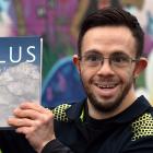 Award-winning Dunedin photographer Carlos Biggemann with a copy of his new book Cumulus: An...