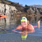 Susan Sherwen samples the 4degC temperature of Blue Lake at St Bathans before competing in an ice...