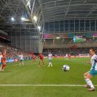 The linesman keeps a close eye as New Zealand's Ali Riley scrambles for the ball during last...
