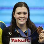Erika Fairweather on the podium with her bronze medal after the race. Photo: Getty Images