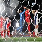 Mathilde Harviken of Norway competes for the ball against Gaelle Thalmann and Ana-Maria...