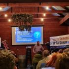 Julian Batchelor, right, talks to about 100 people at The Venue in Wanaka about his Stop co...