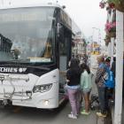 Cruise ship passengers board a bus in Port Chalmers to travel to Dunedin earlier in the year....