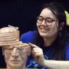 University of Otago PhD student Courteney Westlake examines a section of a brain model during the...