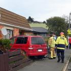 The crash ended with one of the vehicles crashed through a fence in Caversham. Photo: Linda...