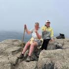 Cheryl Neill (left) and her sister Kim Van Gog take a break at Cape Finisterre, the end of their...