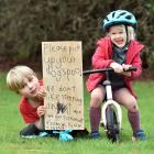 St Leonards children William MacKnight, 7, and Sophie MacKnight, 4, show off their home-made sign...