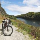 The Lake2Lake Cycle Trail winds along the shore of Lake Manapouri, then follows the Upper Waiau...