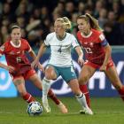 CJ Bott is defended by Swiss players Geraldine Reuteler (left) and Lia Walti. PHOTO: GERARD O’BRIEN