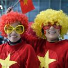 Vietnam supporters Linh Bui (left) and Nguyet Nguyen, both of Auckland, cheer on their team...