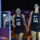 Silver Ferns Whitney Souness (left) and Ameliaranne Ekenasio walk past the Netball World Cup...