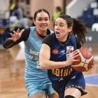 Paige Bradley charges to the hoop for the Southern Hoiho against Northern Kahu defender Elianna...