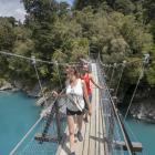 Tourists on the Hokitika Gorge suspension bridge which is earmarked for closure. PHOTO:...