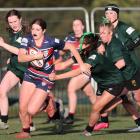 Harriet Cochrane charges through the Avonside Girls' High defence in Christchurch Girls' High's...