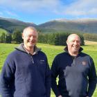 West Otago farm owner Neil Thomson (left) and contract milker Khan Ward discuss their farming...