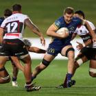 Otago's Fabian Holland eludes a tackle. Photo: Getty Images 