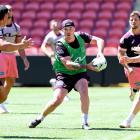 Kobe Hetherington looks to pass during a Broncos training session this week. Photo: Getty Images ...