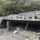 Up to 4m of debris lies on top of the Muddy Creek bridge following flooding last week, which has...