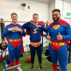 Otago rugby players (from left) Sean Withy, Sam Gilbert and Saula Ma'u dress up as superheroes....