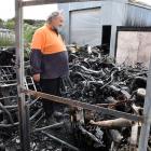 Oamaru man Neville Bryant looks through the remains of his home yesterday morning. PHOTO: STEPHEN...