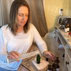 Aromatherapist Sharyn Crawford prepares an essential oil blend at her Helensburgh clinic.PHOTO:...