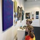 Dunedin youngsters Sequoia Hardisty, 7, and brother Cypress, 9, study the works in the Otago Art...