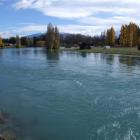 The upper Clutha River flows full and fast, near Albert Town, as the water discharges from the...