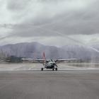 Welcome home: A water arch, courtesy of Queenstown Airport’s fire rescue team, greets Glenorchy...