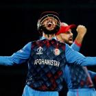 Afghanistan's Ikram Alikhil celebrates after Rashid Khan bowls out&nbsp;England's Mark Wood to...
