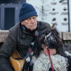Kim Turton with Happy, the famous singing sheepdog muzzled by council. Photo: Rhyva van Onselen